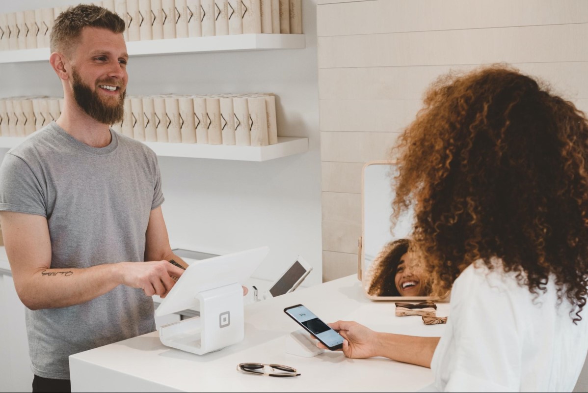 a customer making a purchase in a shop